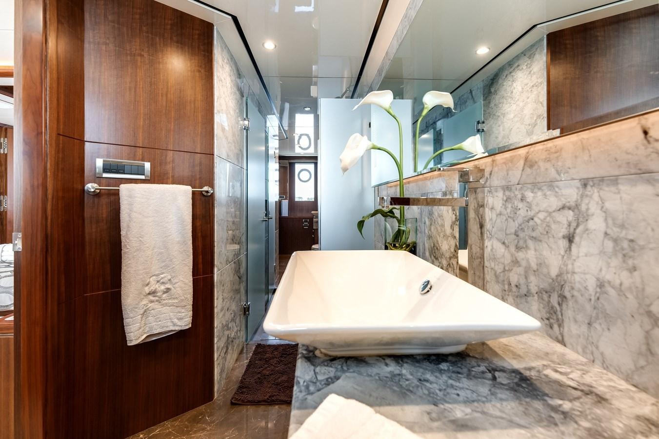 a bathroom with a bathtub and a sink aboard WIGGLE ROOM Yacht for Sale