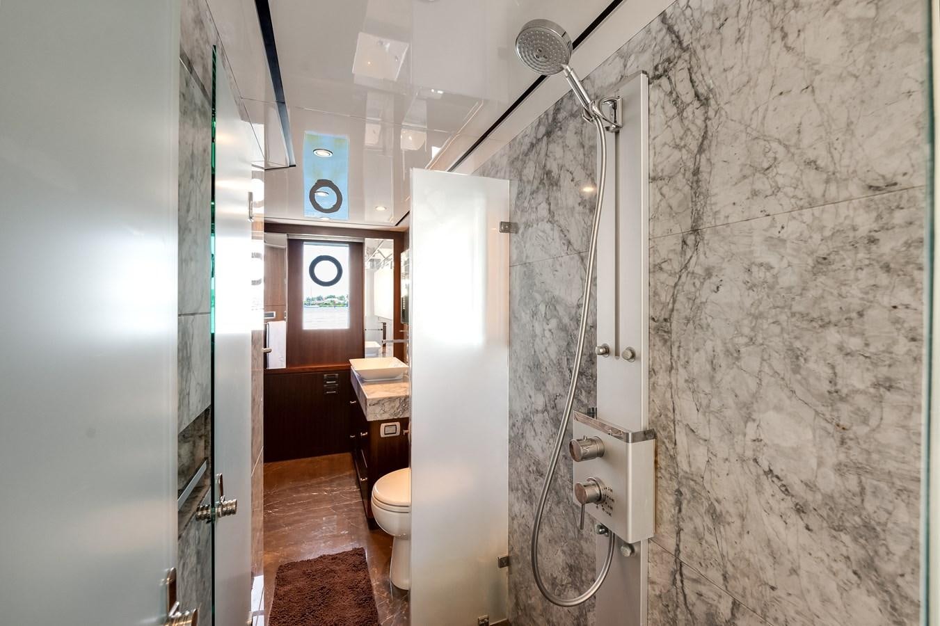 a bathroom with a shower and sink aboard WIGGLE ROOM Yacht for Sale