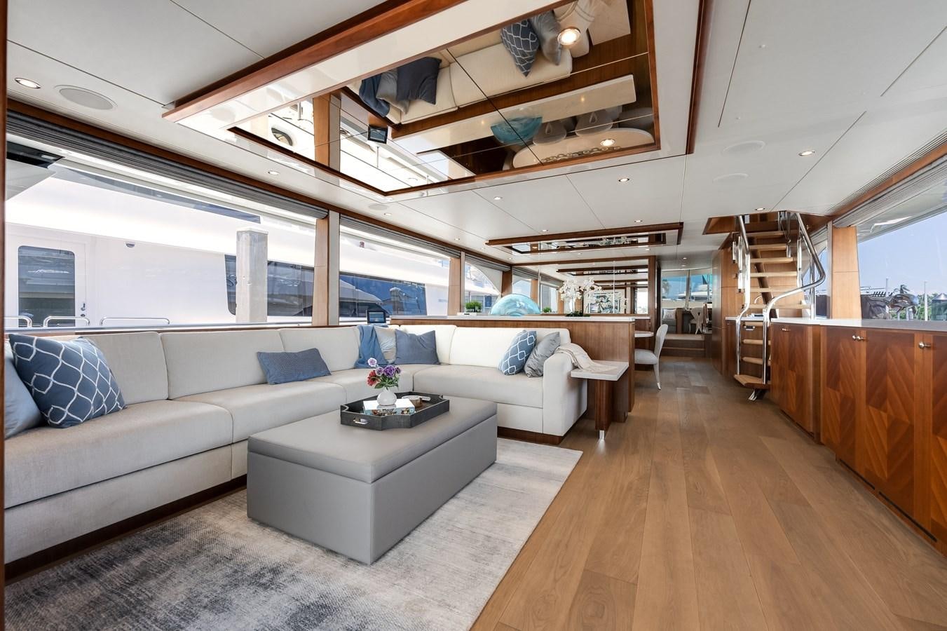 a living room with a large window aboard WIGGLE ROOM Yacht for Sale