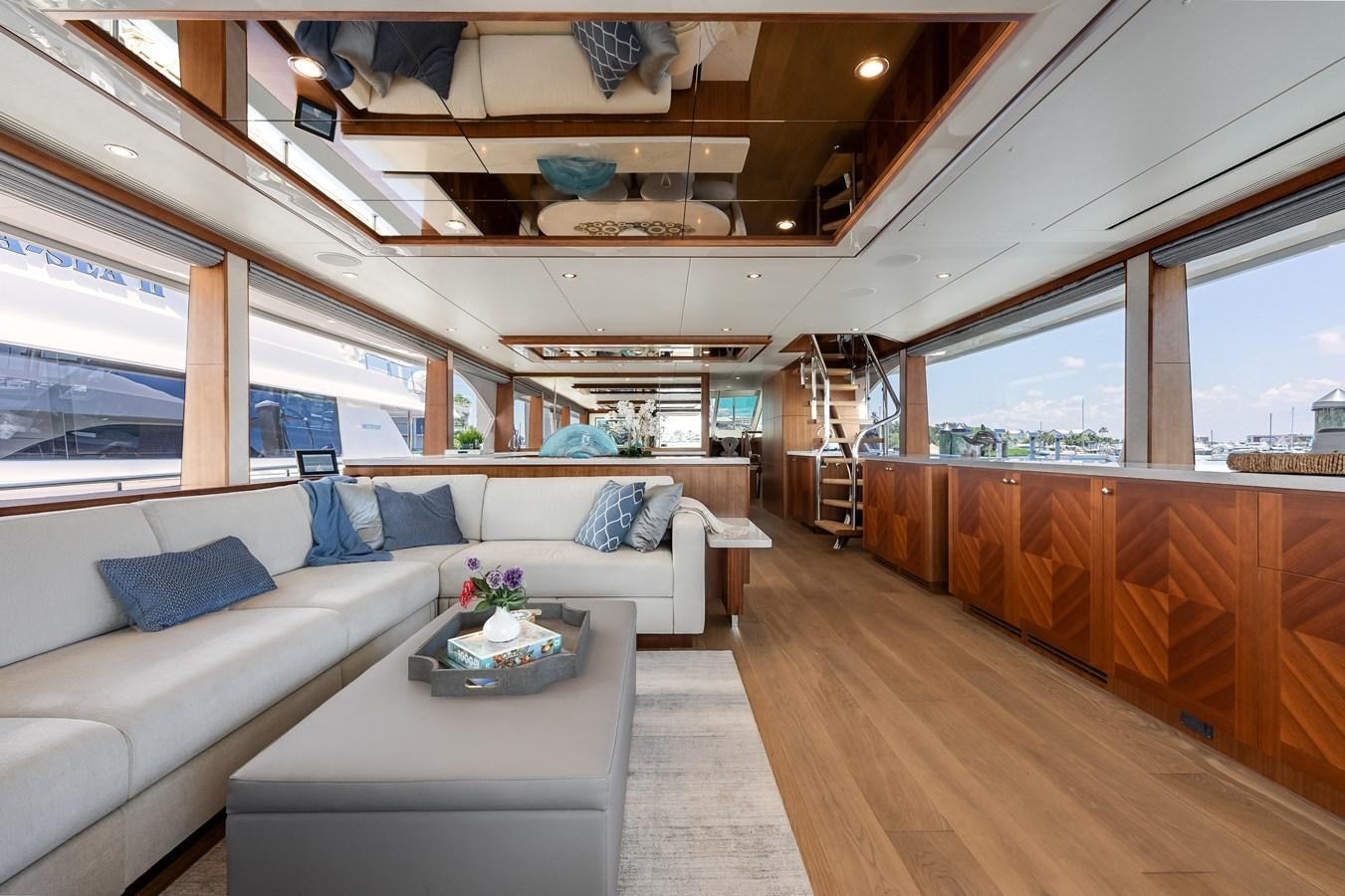 a room with a couch and a table aboard WIGGLE ROOM Yacht for Sale