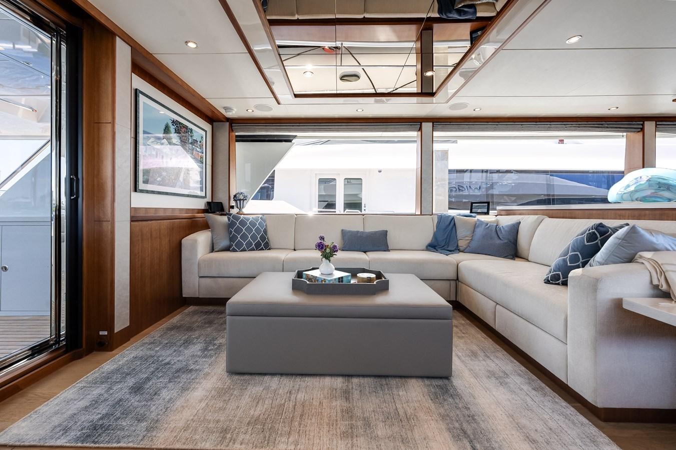 a living room with a large window aboard WIGGLE ROOM Yacht for Sale