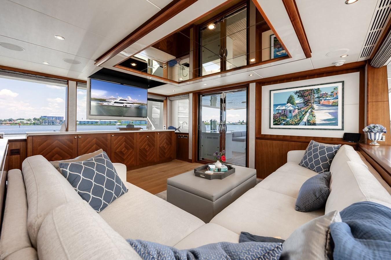 a living room with a couch and a tv aboard WIGGLE ROOM Yacht for Sale
