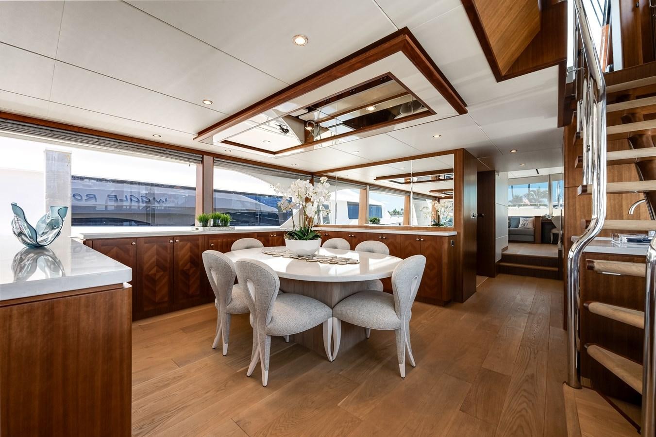 a large kitchen with a dining table aboard WIGGLE ROOM Yacht for Sale