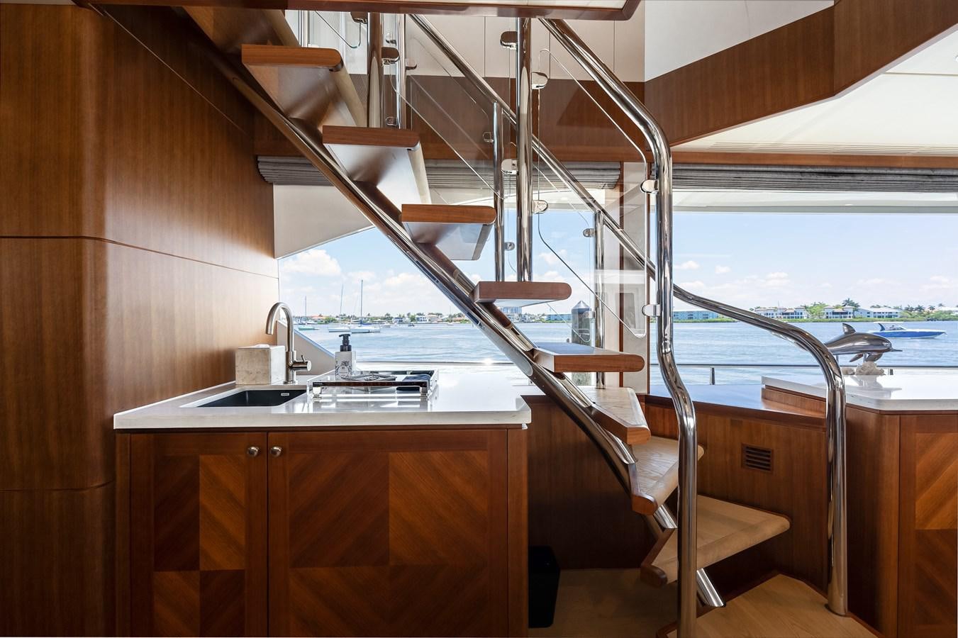 a wooden staircase leading to a balcony aboard WIGGLE ROOM Yacht for Sale