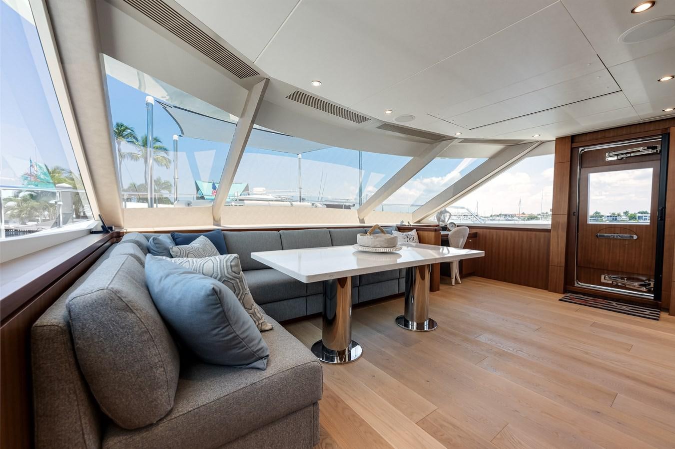 a living room with a couch and a table aboard WIGGLE ROOM Yacht for Sale