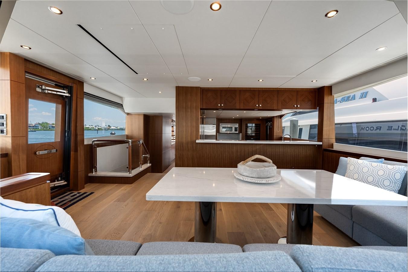 a large kitchen with a table aboard WIGGLE ROOM Yacht for Sale
