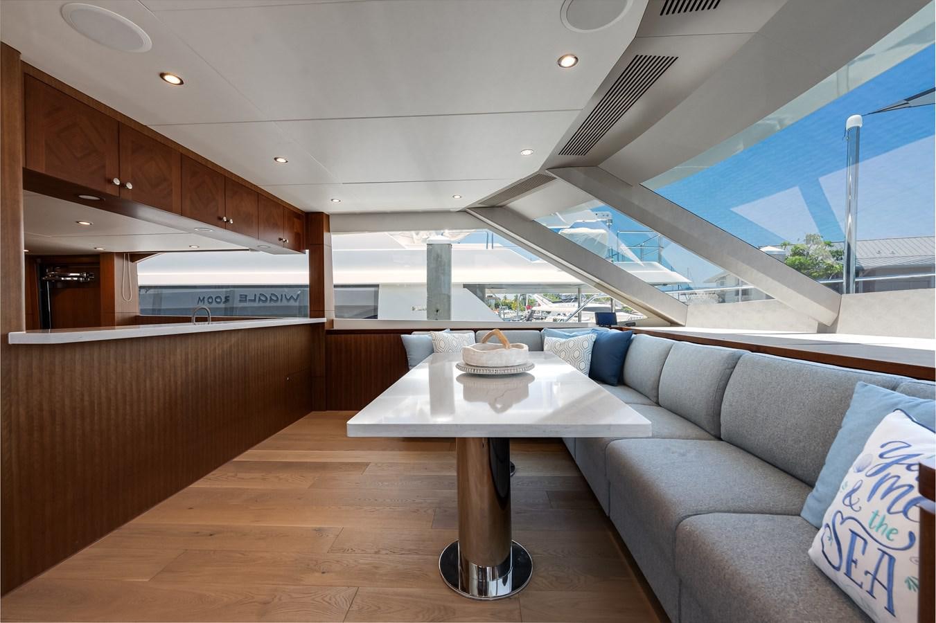 a room with a couch and a table aboard WIGGLE ROOM Yacht for Sale