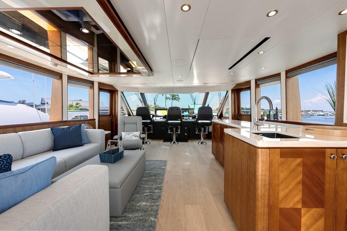 a living room with a couch and a table aboard WIGGLE ROOM Yacht for Sale