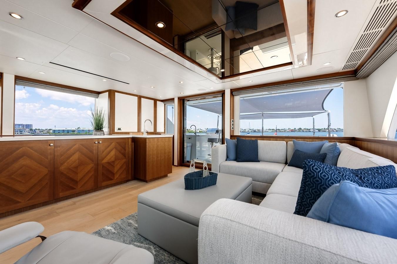 a room with a couch and a table aboard WIGGLE ROOM Yacht for Sale