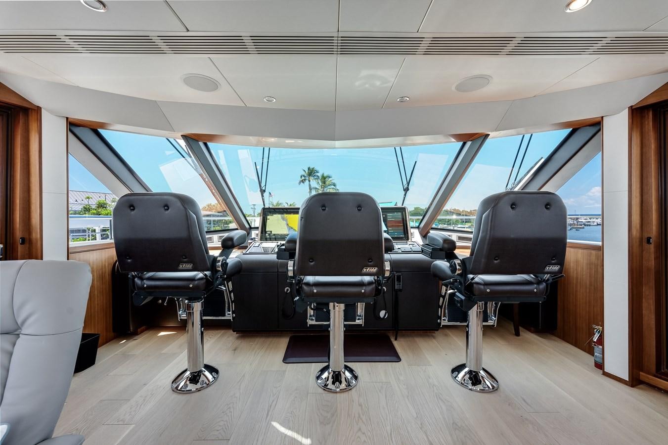 a room with chairs and tables aboard WIGGLE ROOM Yacht for Sale