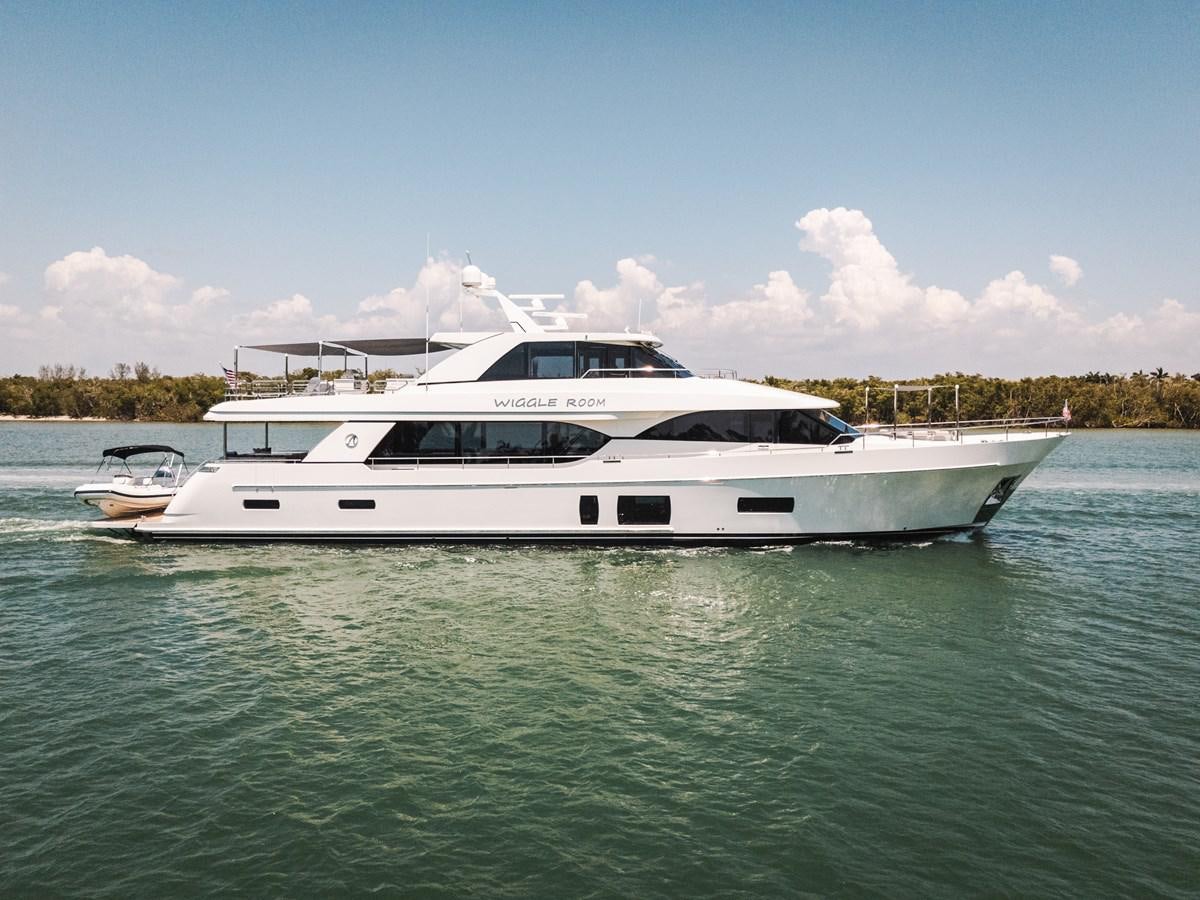 a white yacht in the water aboard WIGGLE ROOM Yacht for Sale
