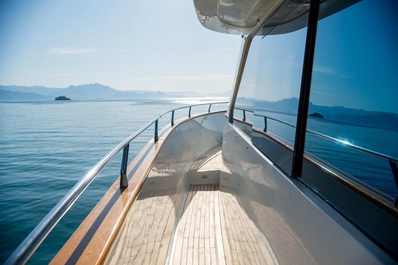 a wooden dock over water aboard TATI Yacht for Sale