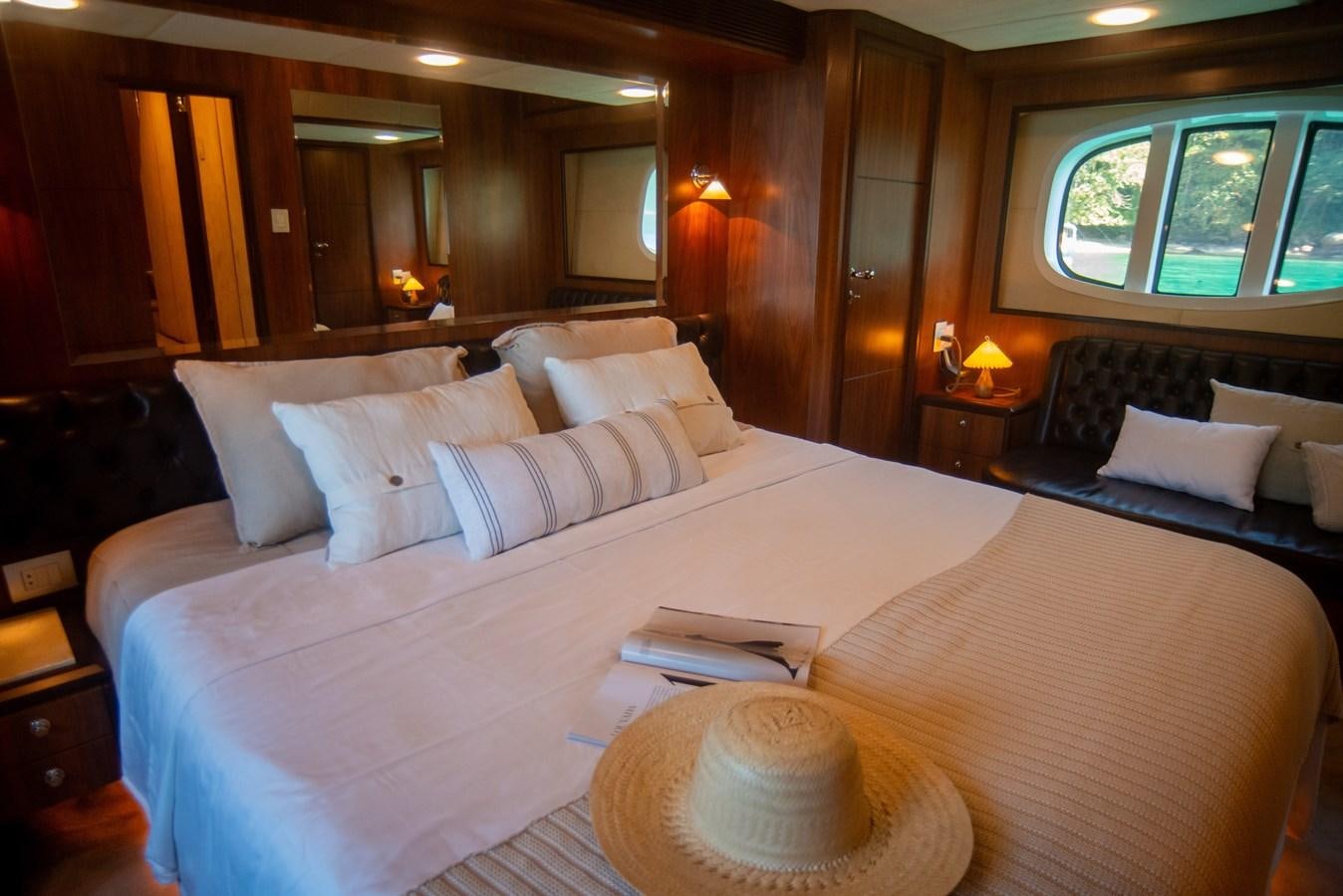 a large bed with a white sheet aboard TATI Yacht for Sale