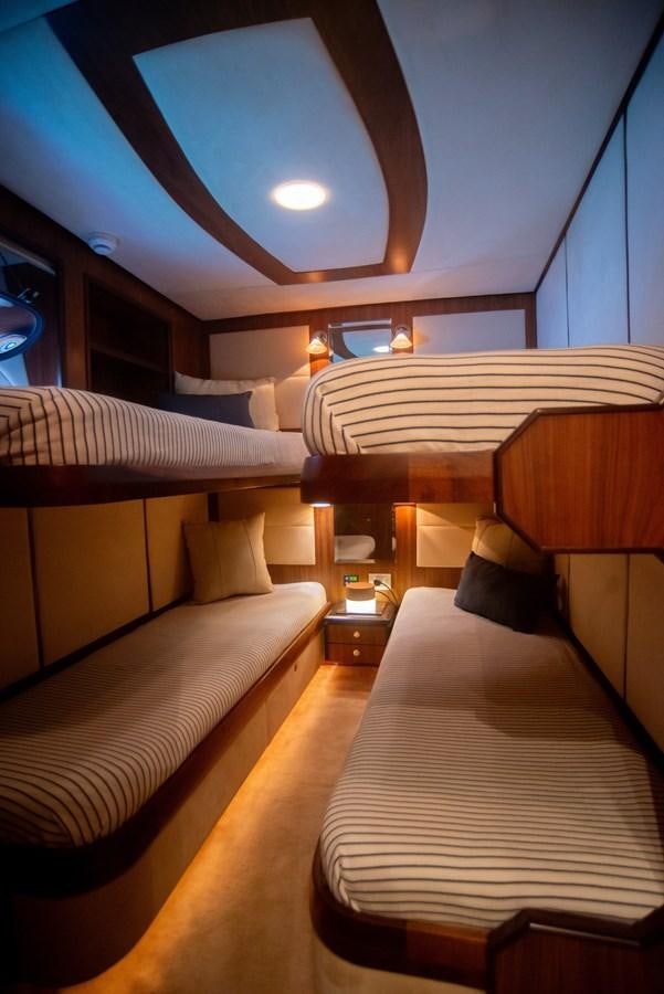 a room with two beds aboard TATI Yacht for Sale