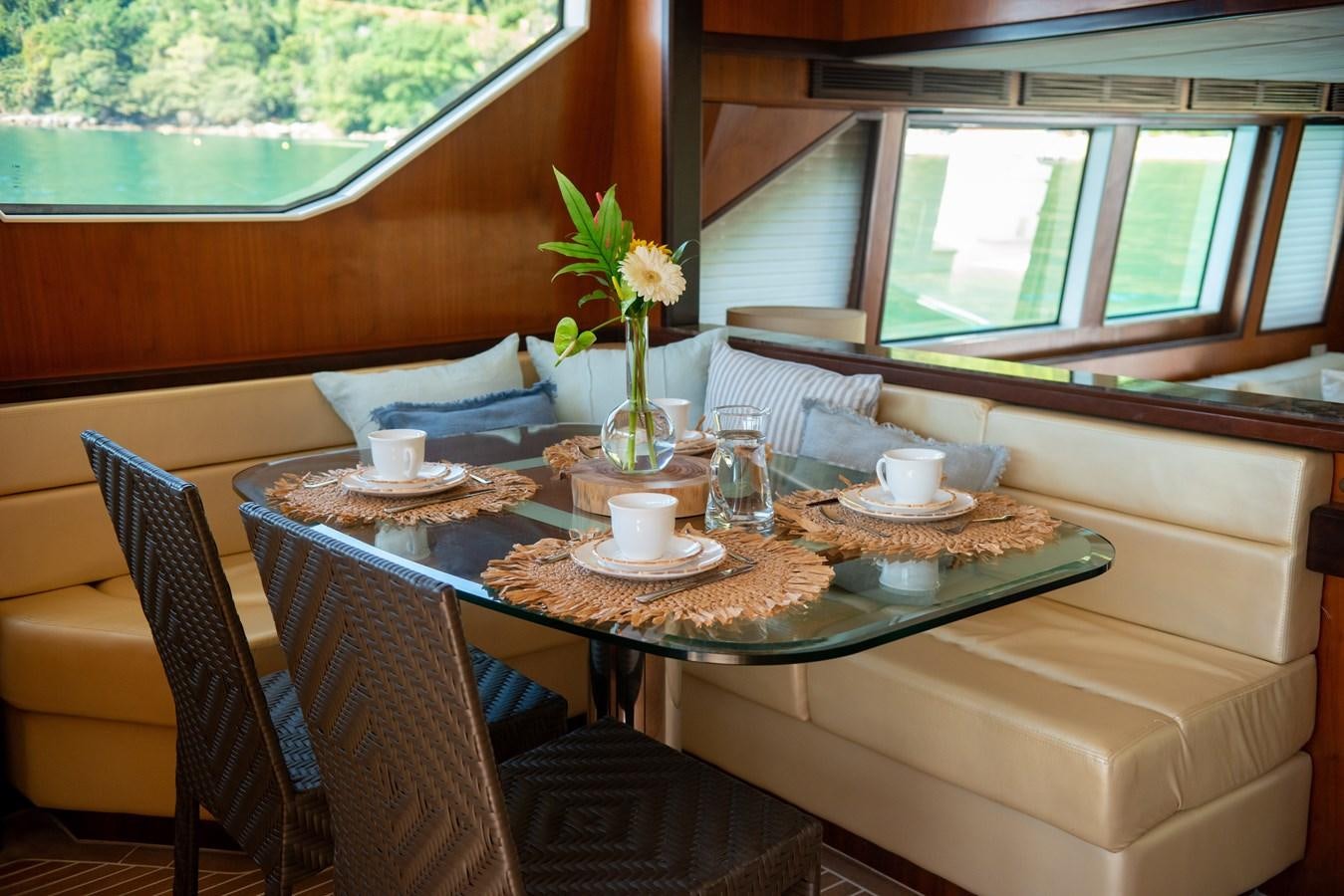 a table with a flower on it aboard TATI Yacht for Sale