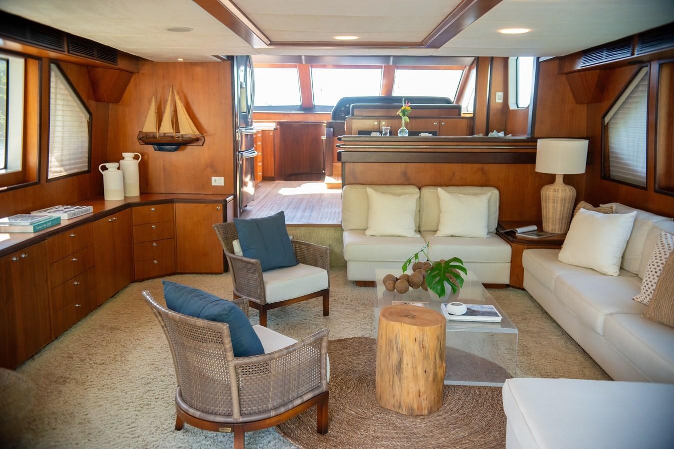 a living room with a couch and a coffee table aboard TATI Yacht for Sale