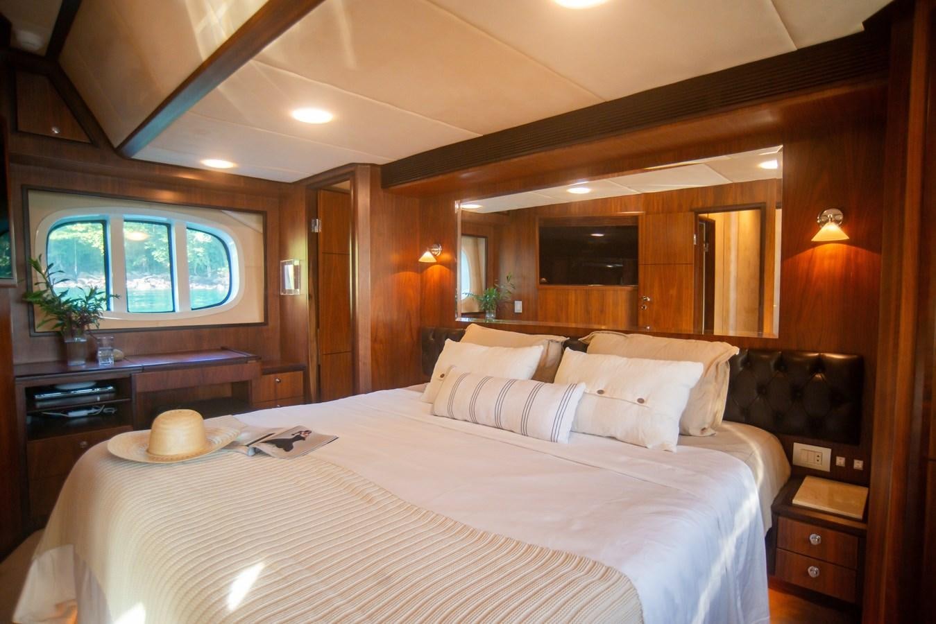 a large bed in a room aboard TATI Yacht for Sale