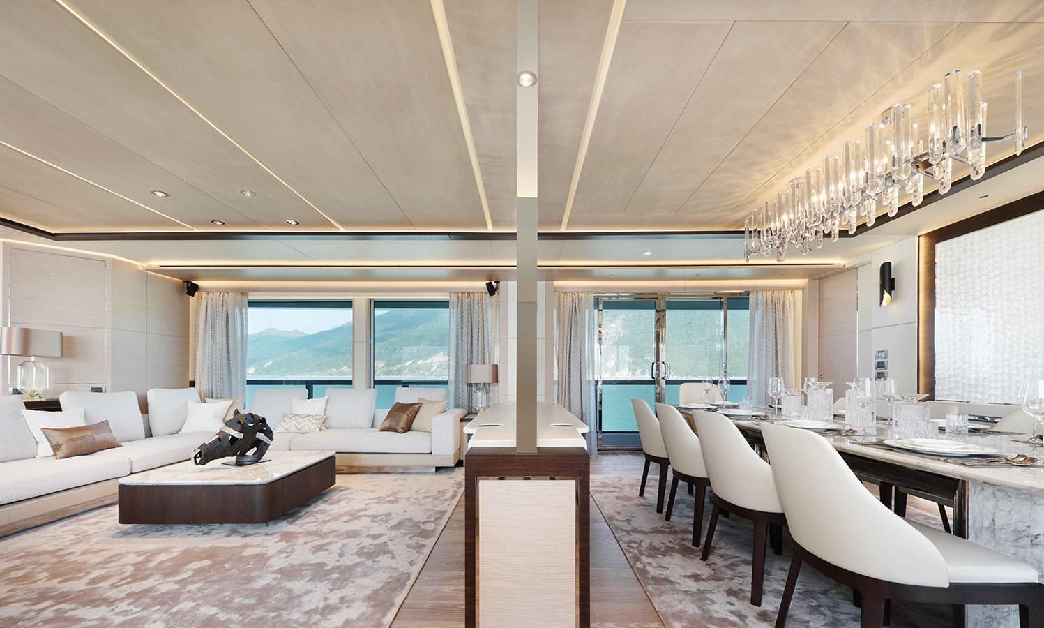 a large living room with a large white sofa and a large window aboard HEYSEA ASTERIA 139/3 Yacht for Sale