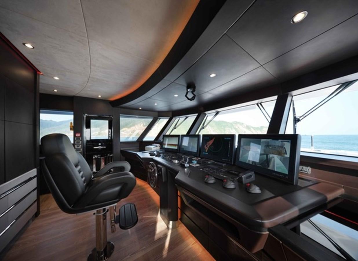 a room with many monitors and computers aboard HEYSEA ASTERIA 139/3 Yacht for Sale