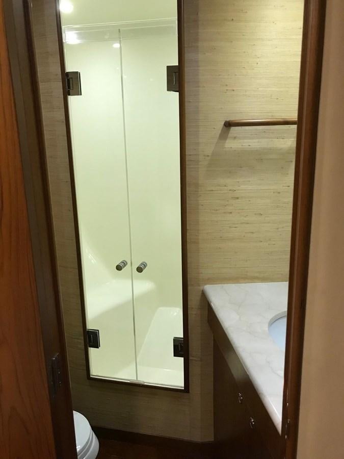 a bathroom with a sink and a shower aboard IN FLIGHT Yacht for Sale