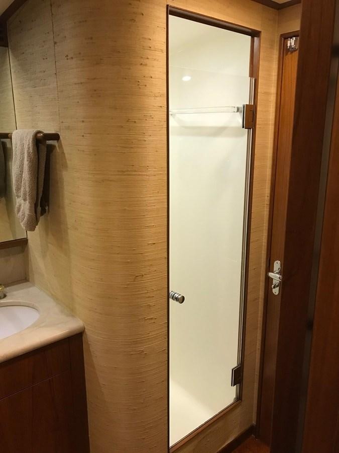 a bathroom with a shower and sink aboard IN FLIGHT Yacht for Sale