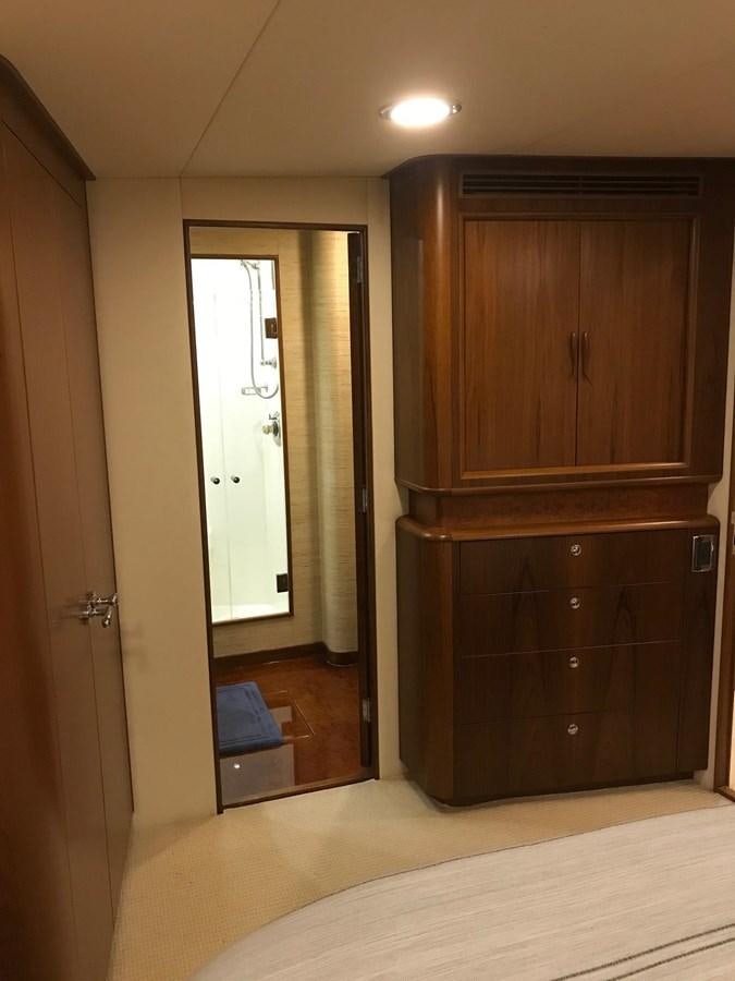 a room with a closet and a bed aboard IN FLIGHT Yacht for Sale