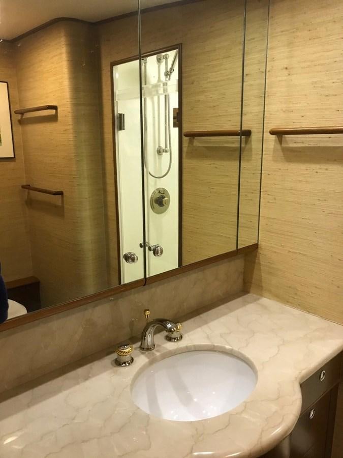 a bathroom with a large mirror aboard IN FLIGHT Yacht for Sale
