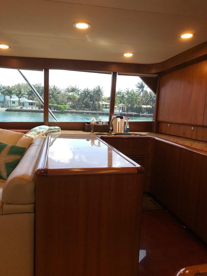 a kitchen with a table and chairs aboard IN FLIGHT Yacht for Sale