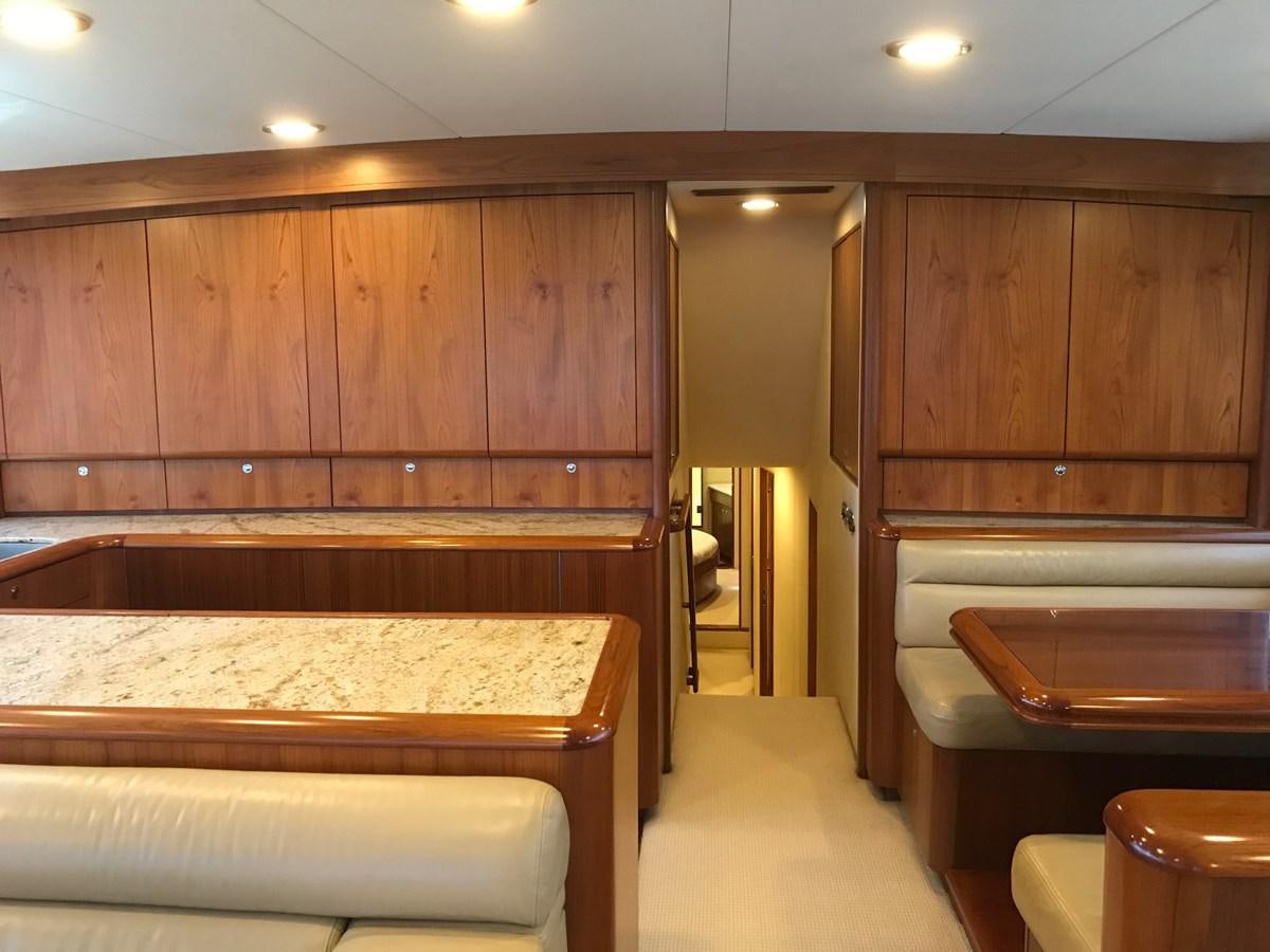 a room with wooden cabinets aboard IN FLIGHT Yacht for Sale