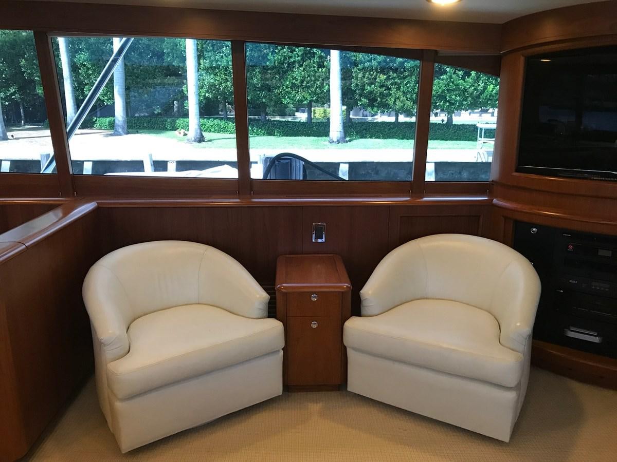 a living room with a couch and a tv aboard IN FLIGHT Yacht for Sale