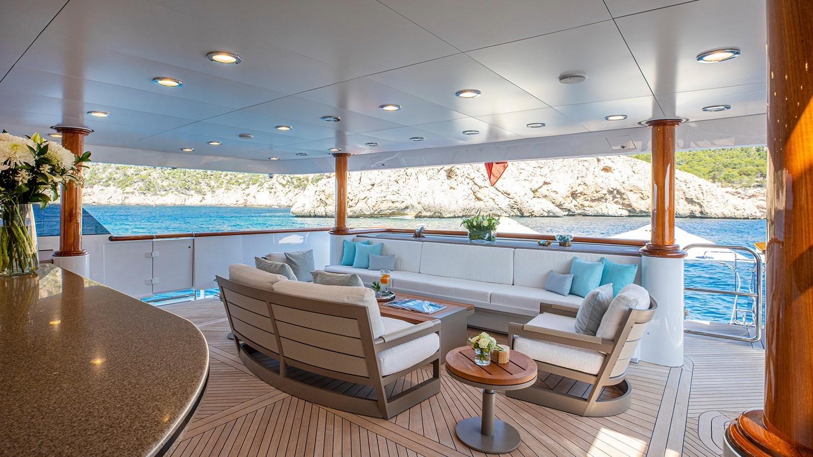 a living room with a large balcony aboard LA DEA II Yacht for Sale
