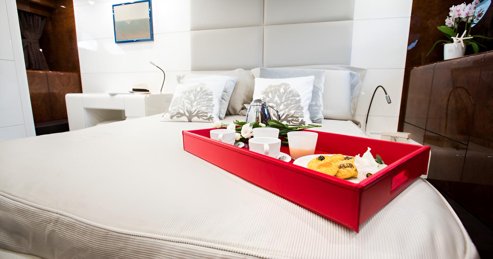 a table with food on it aboard CAMILLA A Yacht for Sale