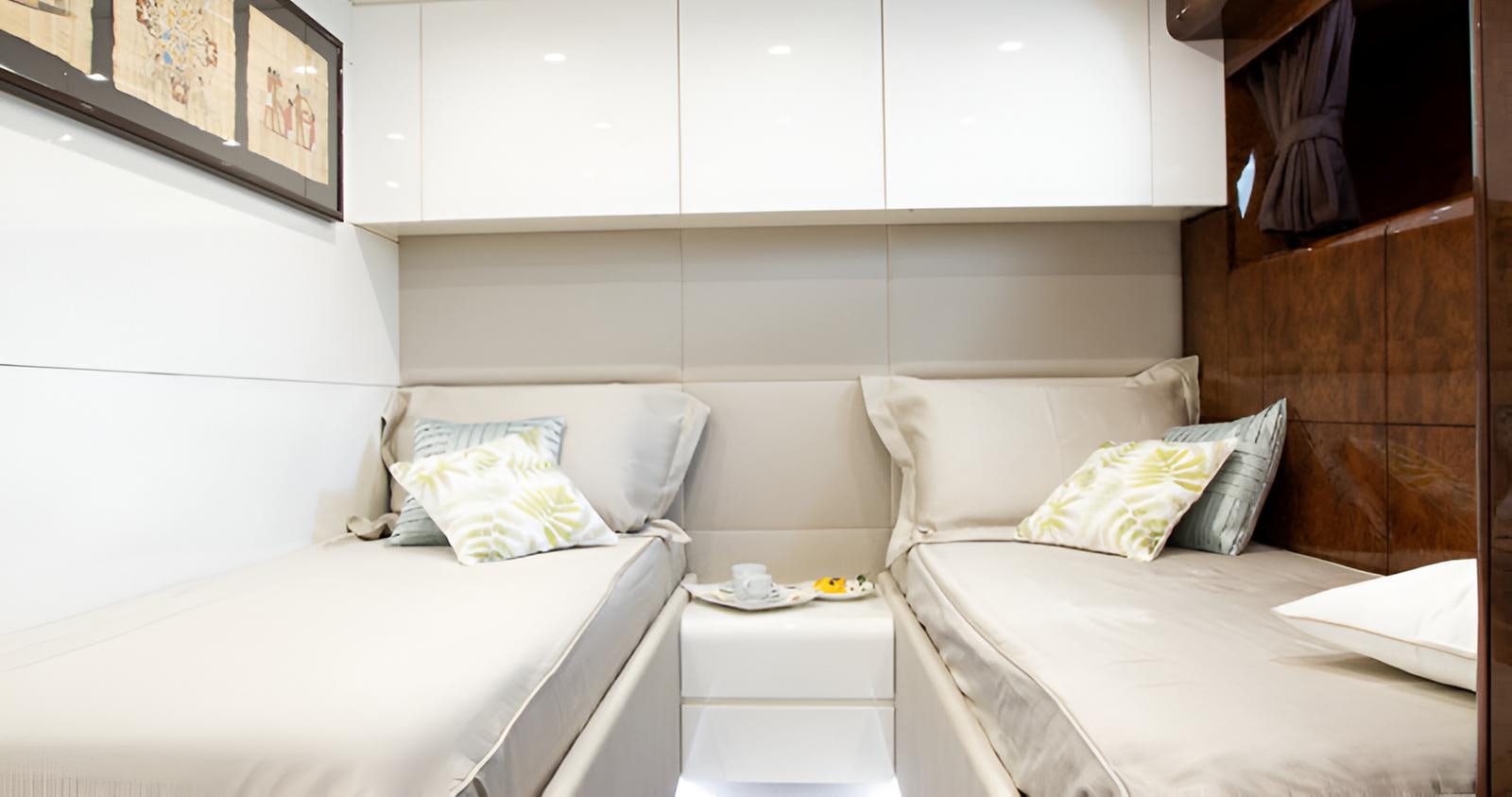 a couple of beds in a room aboard CAMILLA A Yacht for Sale