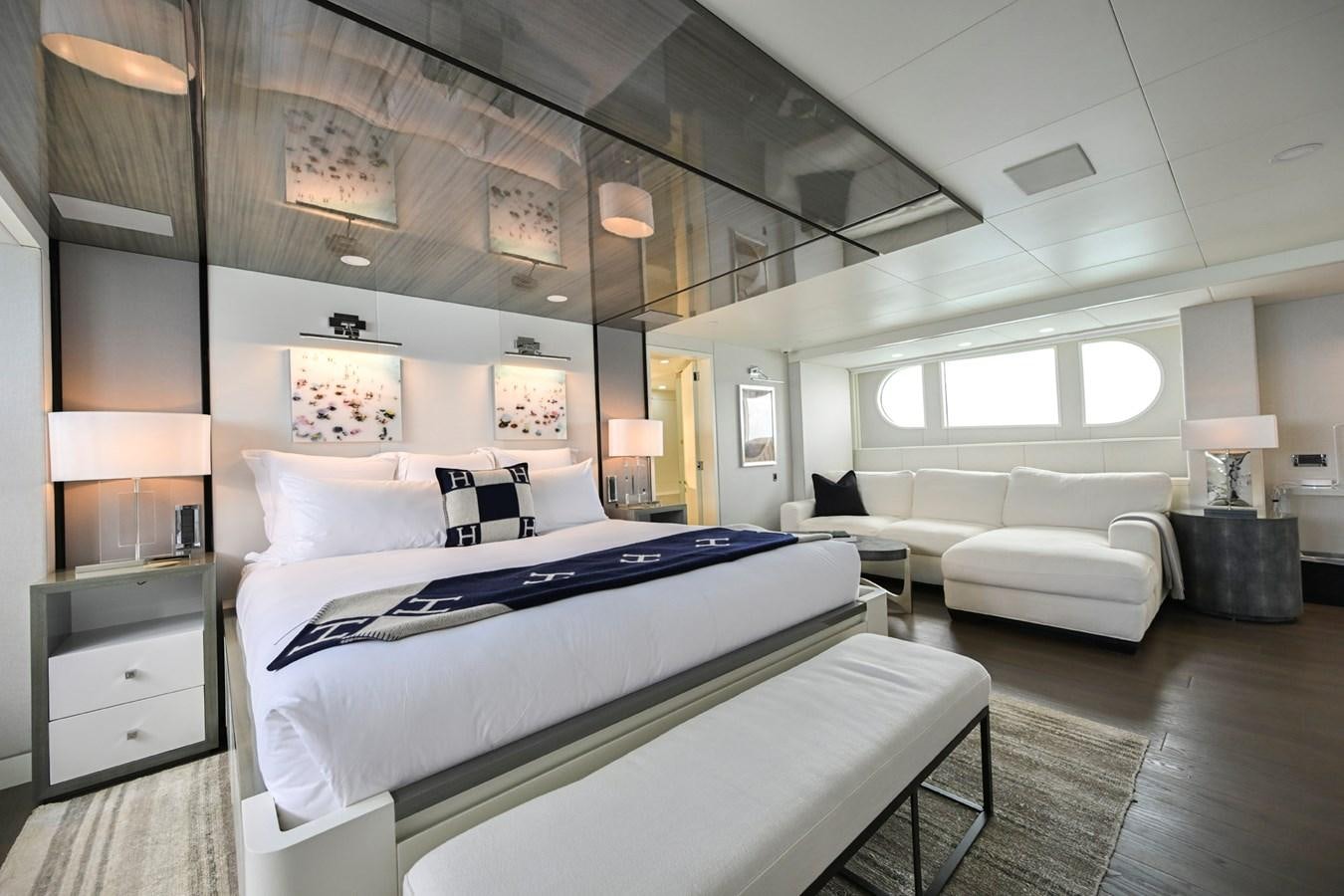 a room with a bed and a couch aboard BG CHARADE Yacht for Sale