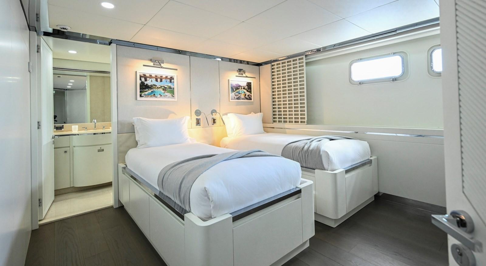 a room with two beds aboard BG CHARADE Yacht for Sale