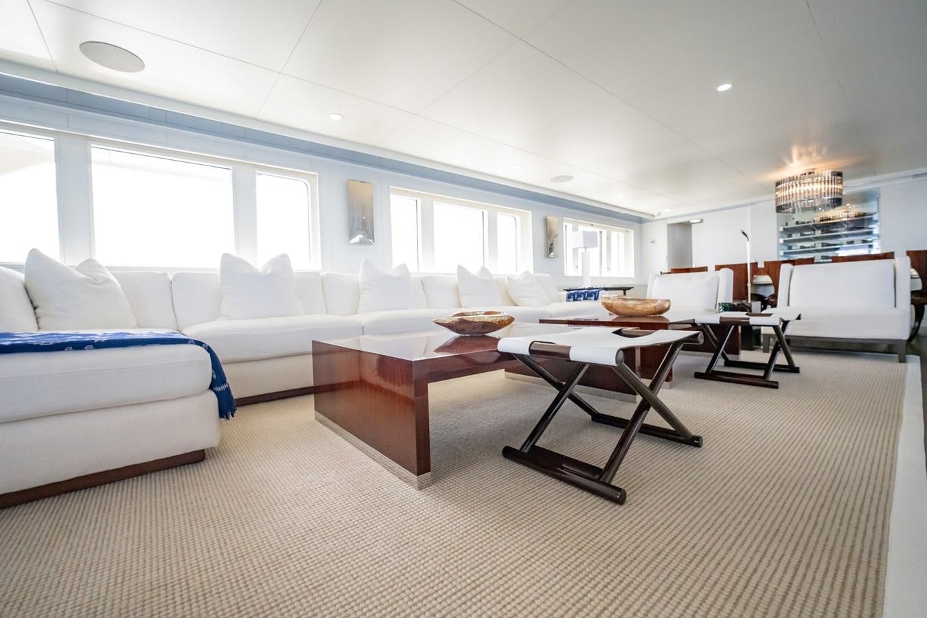 a living room with a couch and a table aboard BG CHARADE Yacht for Sale