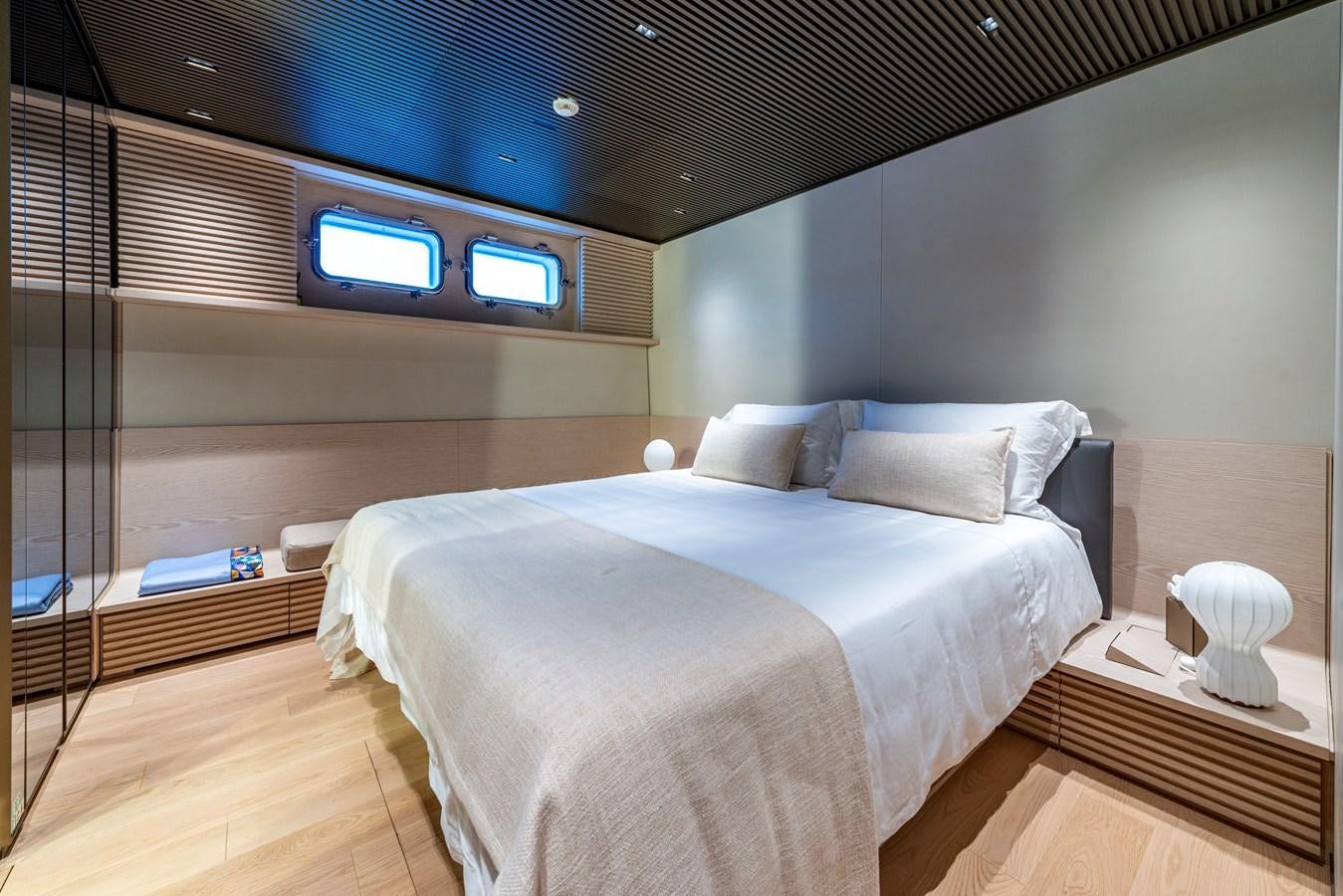 a bed in a room aboard HH Yacht for Sale