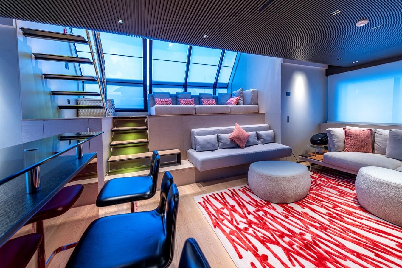 a room with a couch and a table aboard HH Yacht for Sale