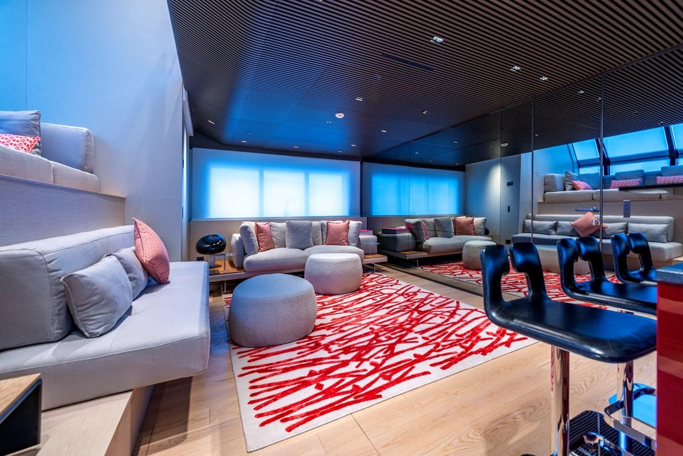 a room with a red rug aboard HH Yacht for Sale