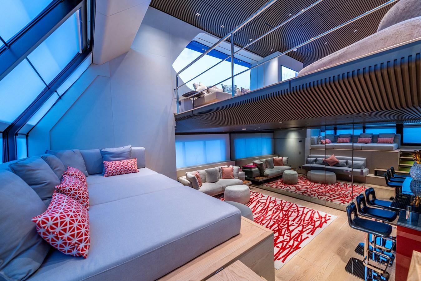 a room with a bed and a couch aboard HH Yacht for Sale