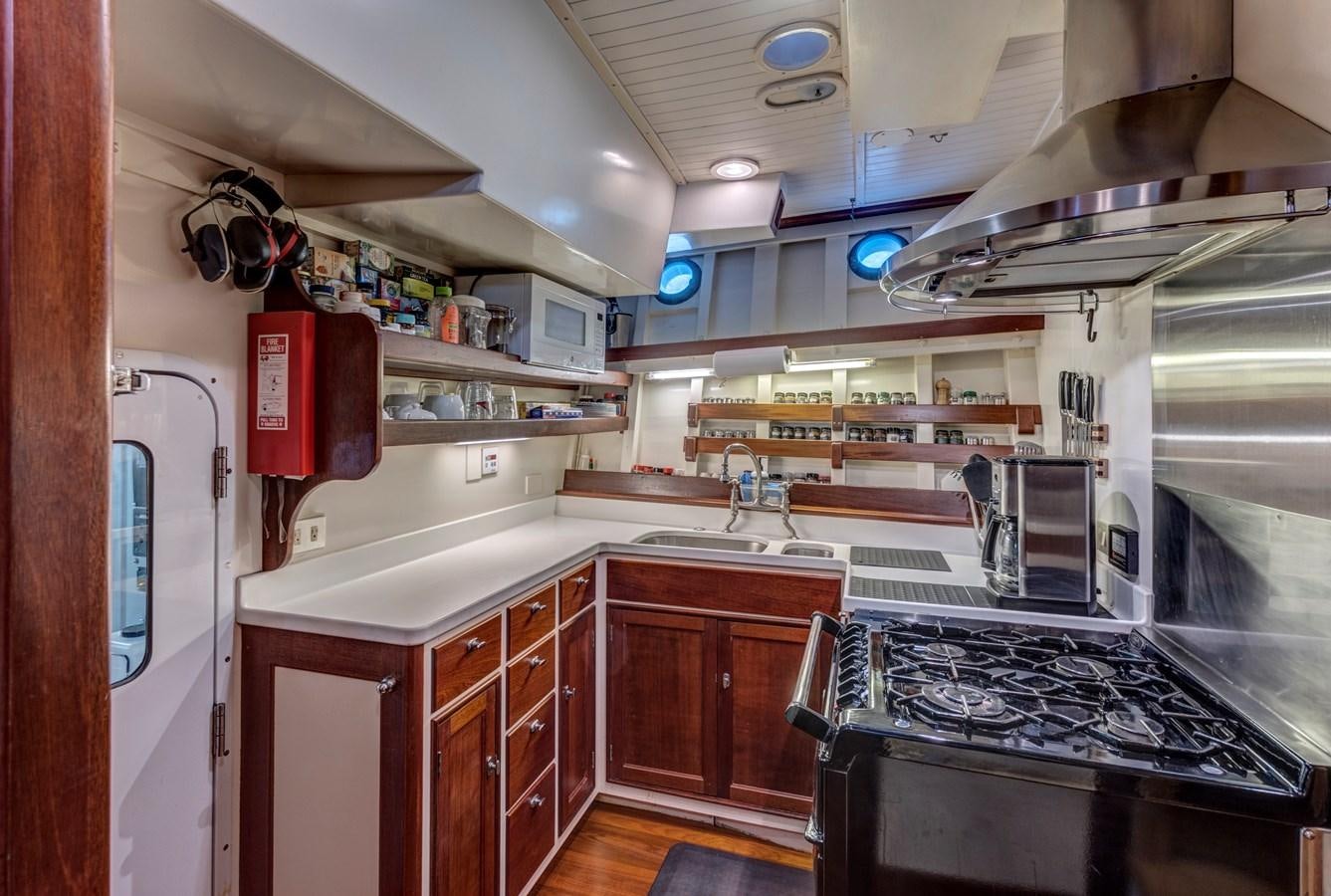 a kitchen with a stove and oven aboard ANNABELLE Yacht for Sale
