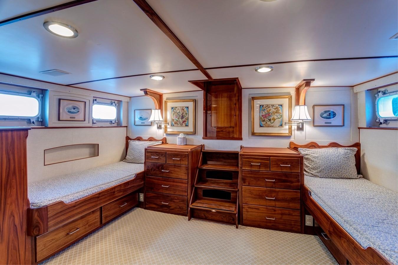 a bedroom with a bed and a dresser aboard ANNABELLE Yacht for Sale