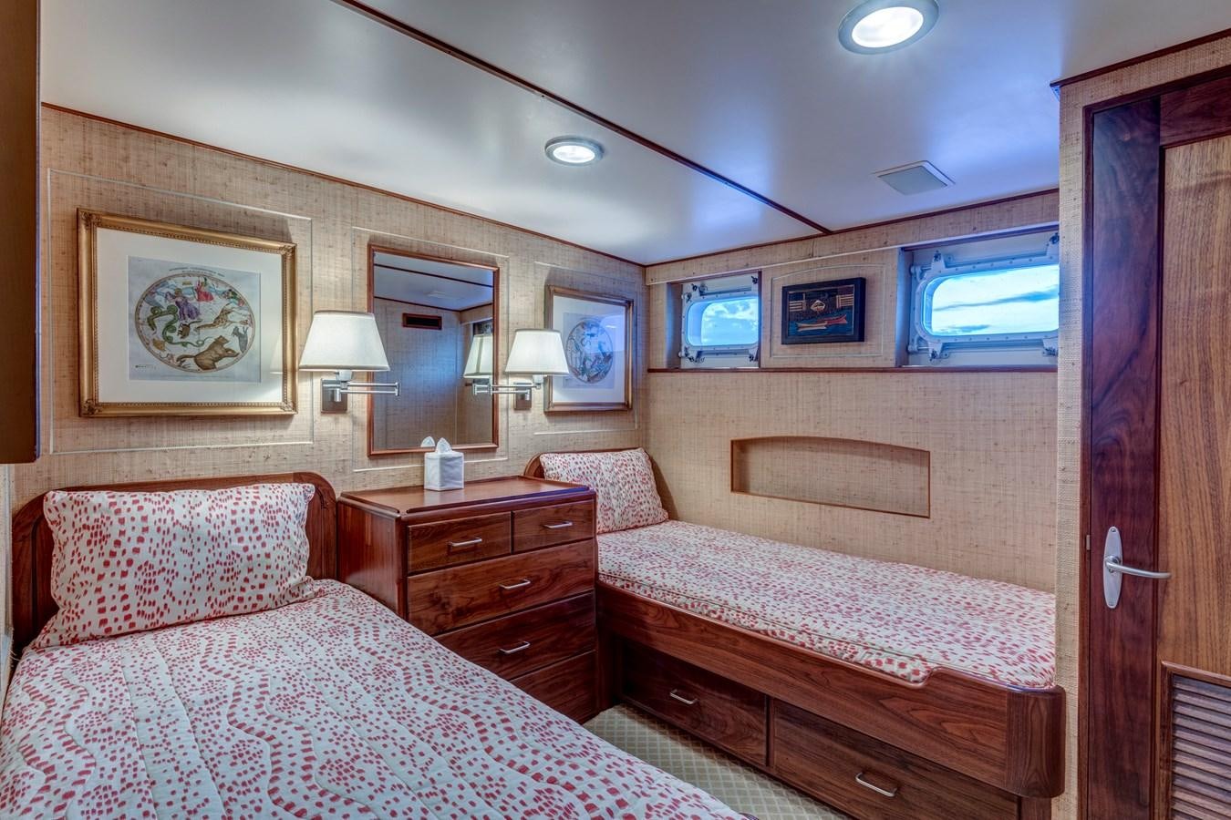 a bedroom with a bed and a dresser aboard ANNABELLE Yacht for Sale