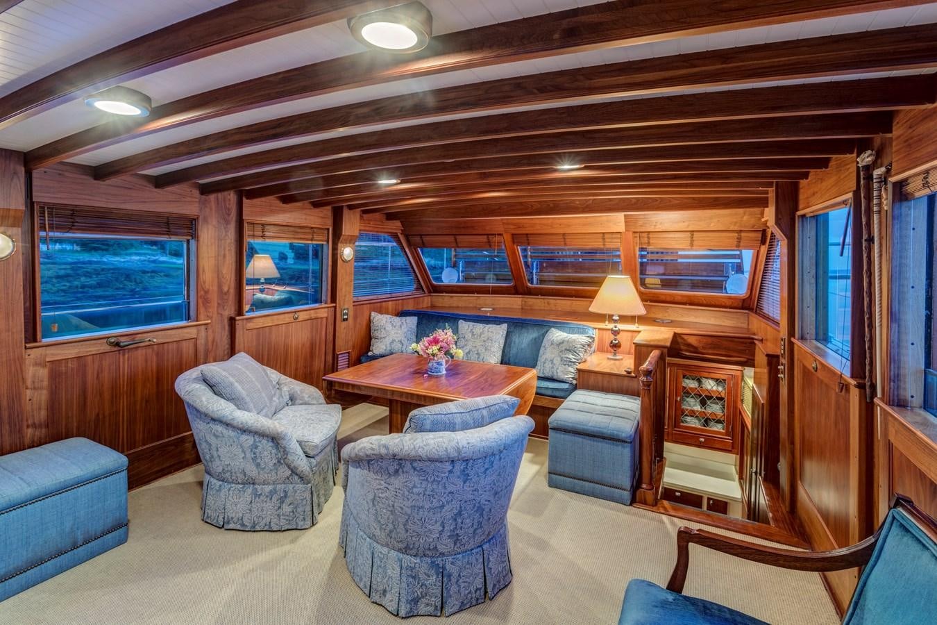 a living room with a couch and a coffee table aboard ANNABELLE Yacht for Sale