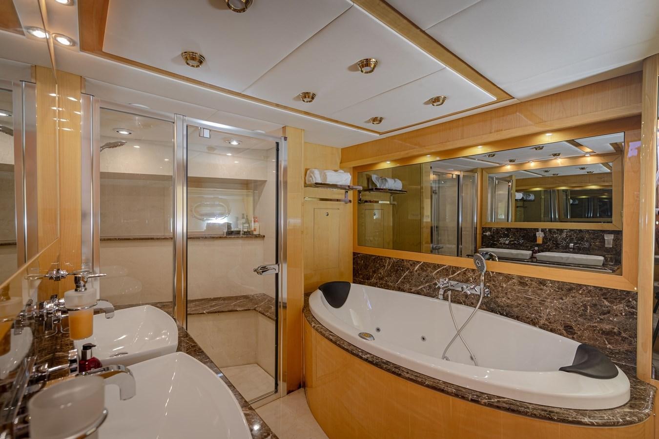 a bathroom with a large bathtub aboard KING OF OIL Yacht for Sale