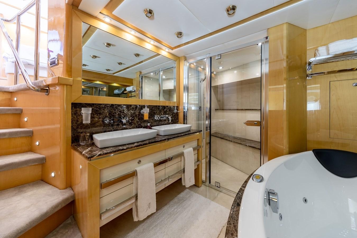 a bathroom with a large mirror aboard KING OF OIL Yacht for Sale
