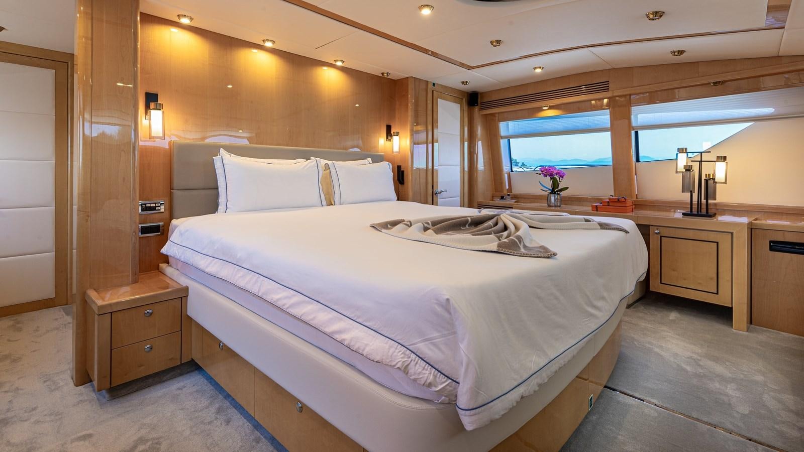 a large bed in a room aboard KING OF OIL Yacht for Sale