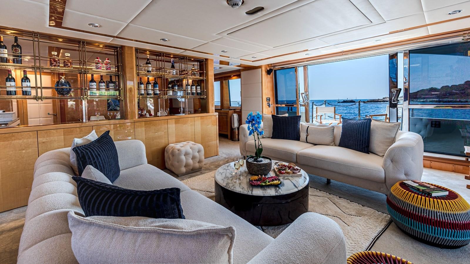 a living room with a large window aboard KING OF OIL Yacht for Sale