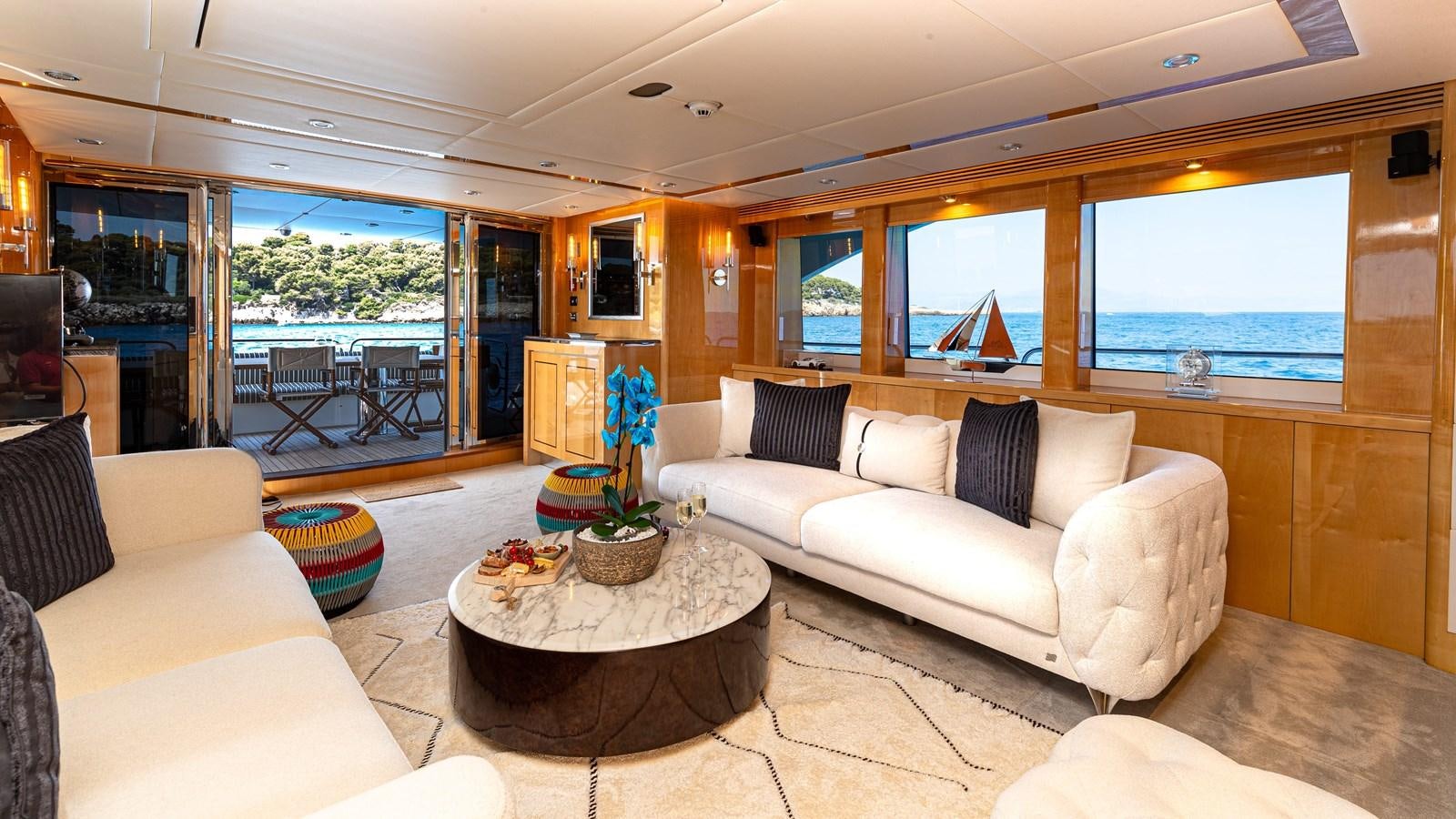 a living room with a large window aboard KING OF OIL Yacht for Sale