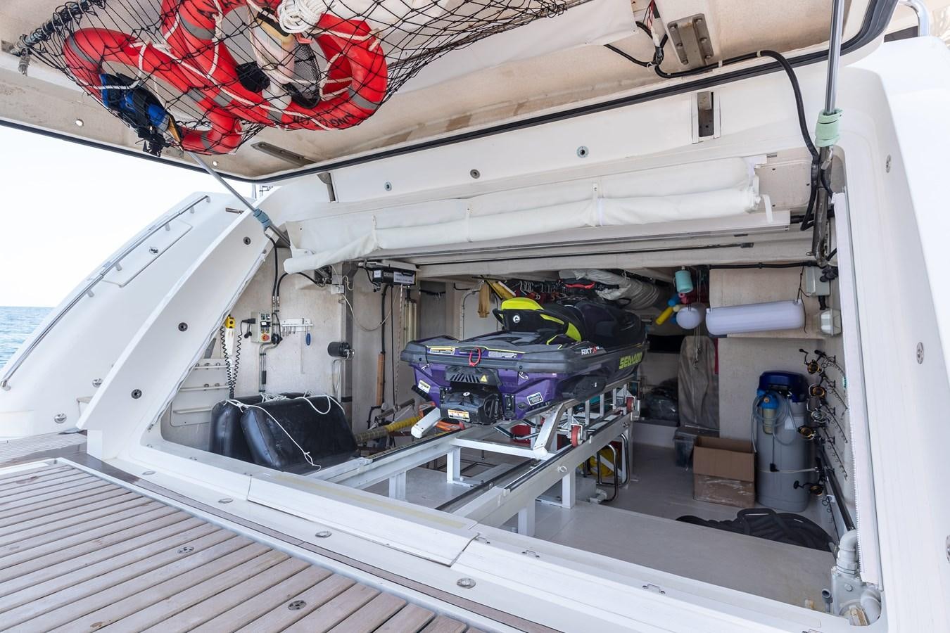 a white boat with a blue object on it aboard KING OF OIL Yacht for Sale